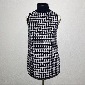 Chico’s Houndstooth sleeveless mock neck sweater.